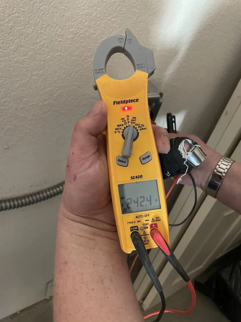Voltage testing with clamp meter during Whole House Surge Protector in Waller